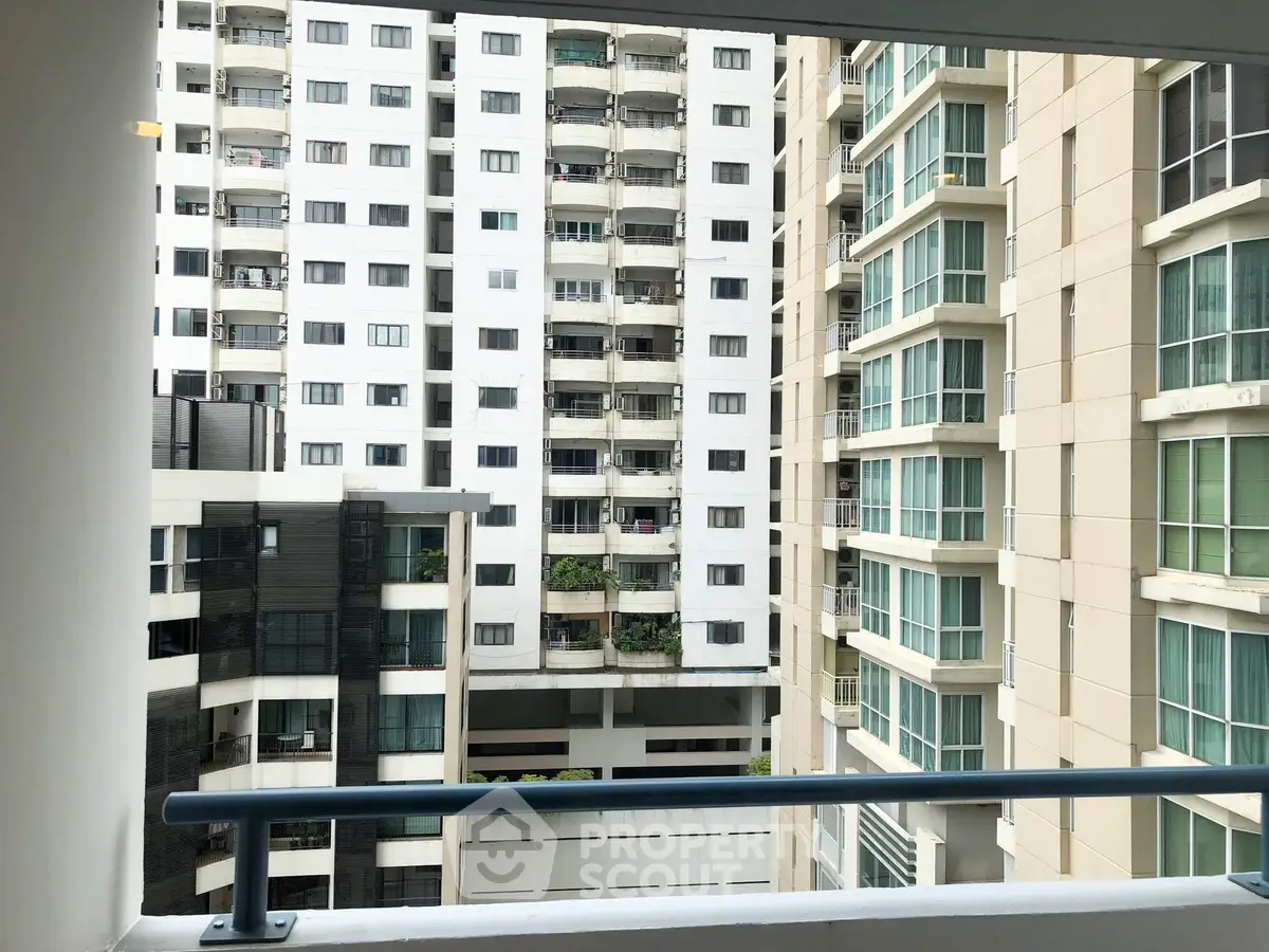 Modern high-rise apartment buildings with balconies and large windows