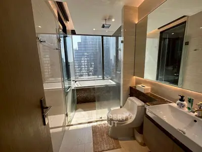 Luxurious modern bathroom with city view and elegant fixtures