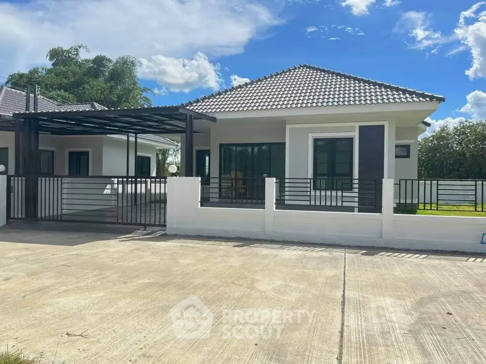 Charming modern house with tiled roof and spacious driveway in serene neighborhood.