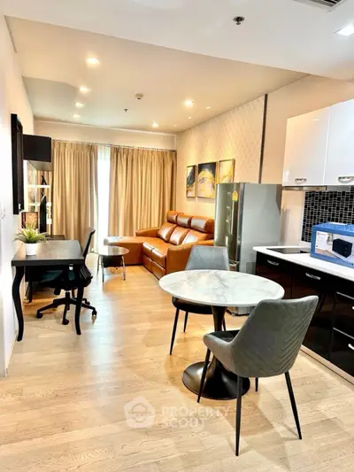 Modern living room with stylish furniture and open kitchen layout