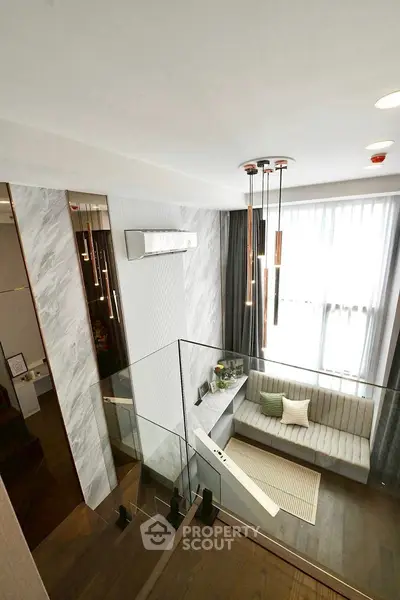 Modern duplex living room with stylish decor and large windows