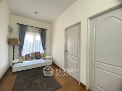 Cozy small living area with natural light and modern decor
