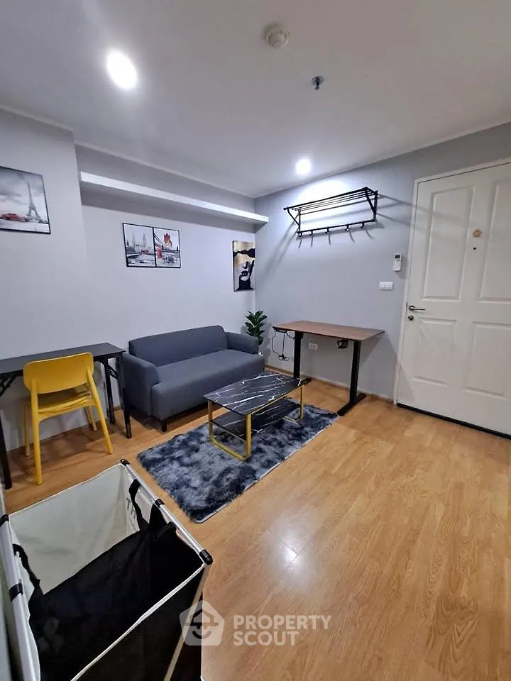 Modern living room with stylish decor and cozy seating area, perfect for relaxation and entertaining.