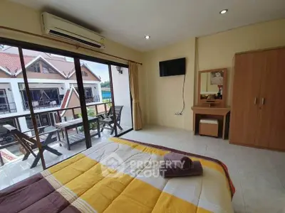 Cozy bedroom with balcony view in modern apartment