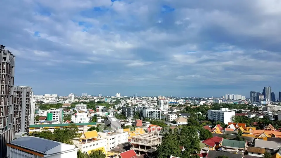 Stunning cityscape view showcasing vibrant urban skyline under a blue sky.