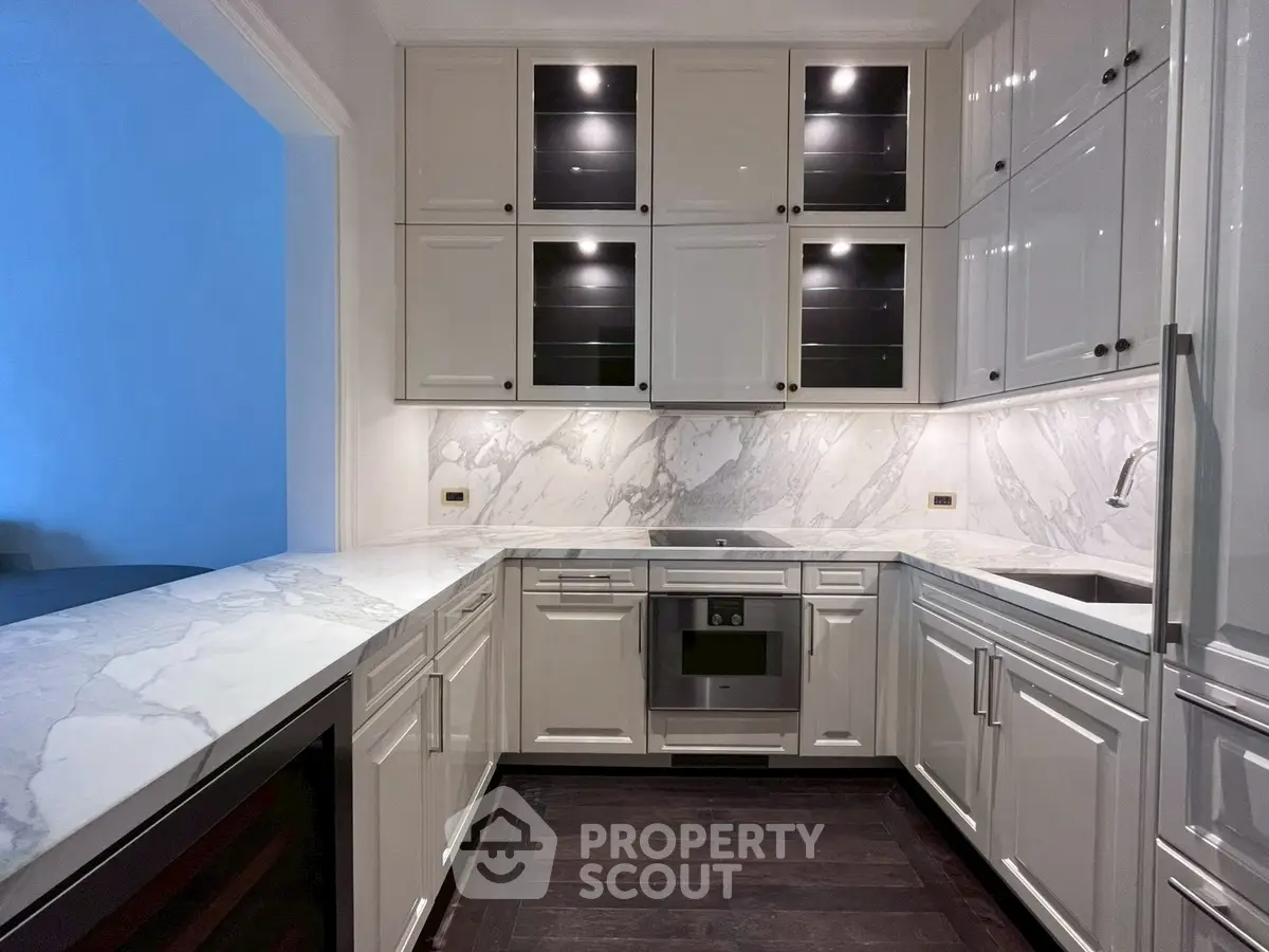 Luxurious modern kitchen with marble countertops and sleek cabinetry