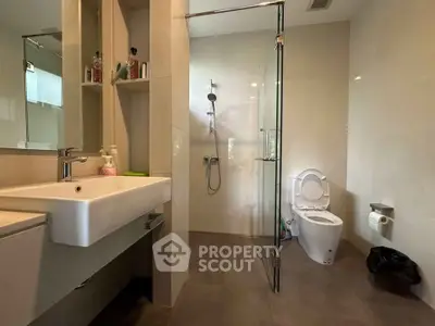 Modern bathroom with glass shower and sleek fixtures