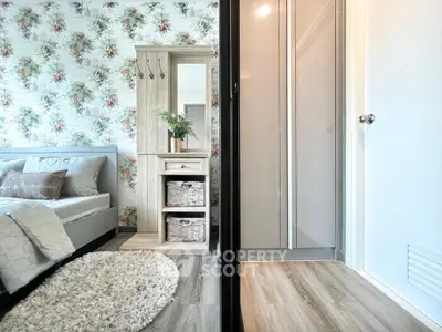 Charming bedroom with floral wallpaper and cozy decor in modern apartment