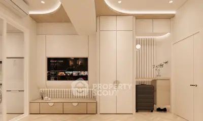 Modern living room with built-in storage and TV, featuring elegant lighting and minimalist decor.