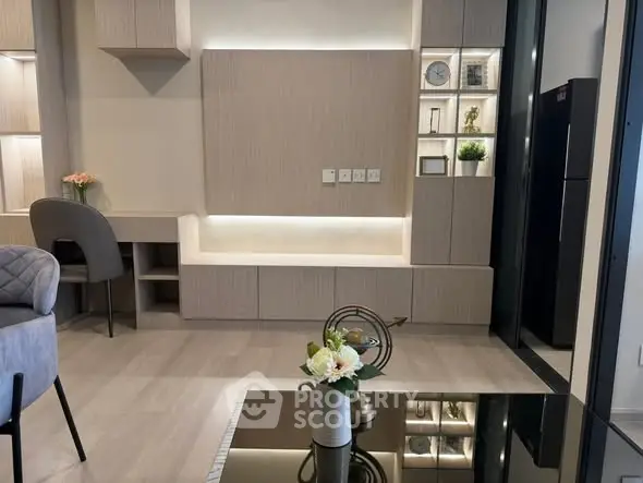 Modern living room with stylish furniture and built-in shelving