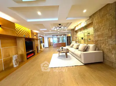 Luxurious living room with modern decor, spacious layout, and elegant lighting in a high-end property.