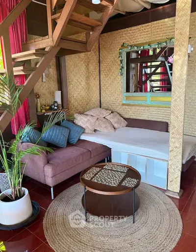 Charming loft-style living room with cozy seating and rustic decor