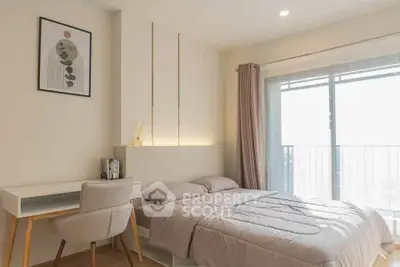 Modern bedroom with stylish decor and balcony view, perfect for urban living.