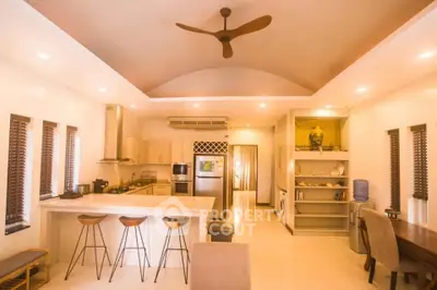 Spacious open-layout kitchen with modern appliances and stylish decor