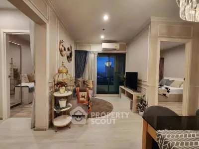 Stylish living room with modern decor and city view balcony access
