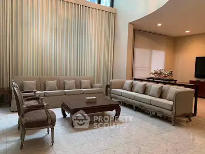 Elegant living room with classic furniture and high ceilings