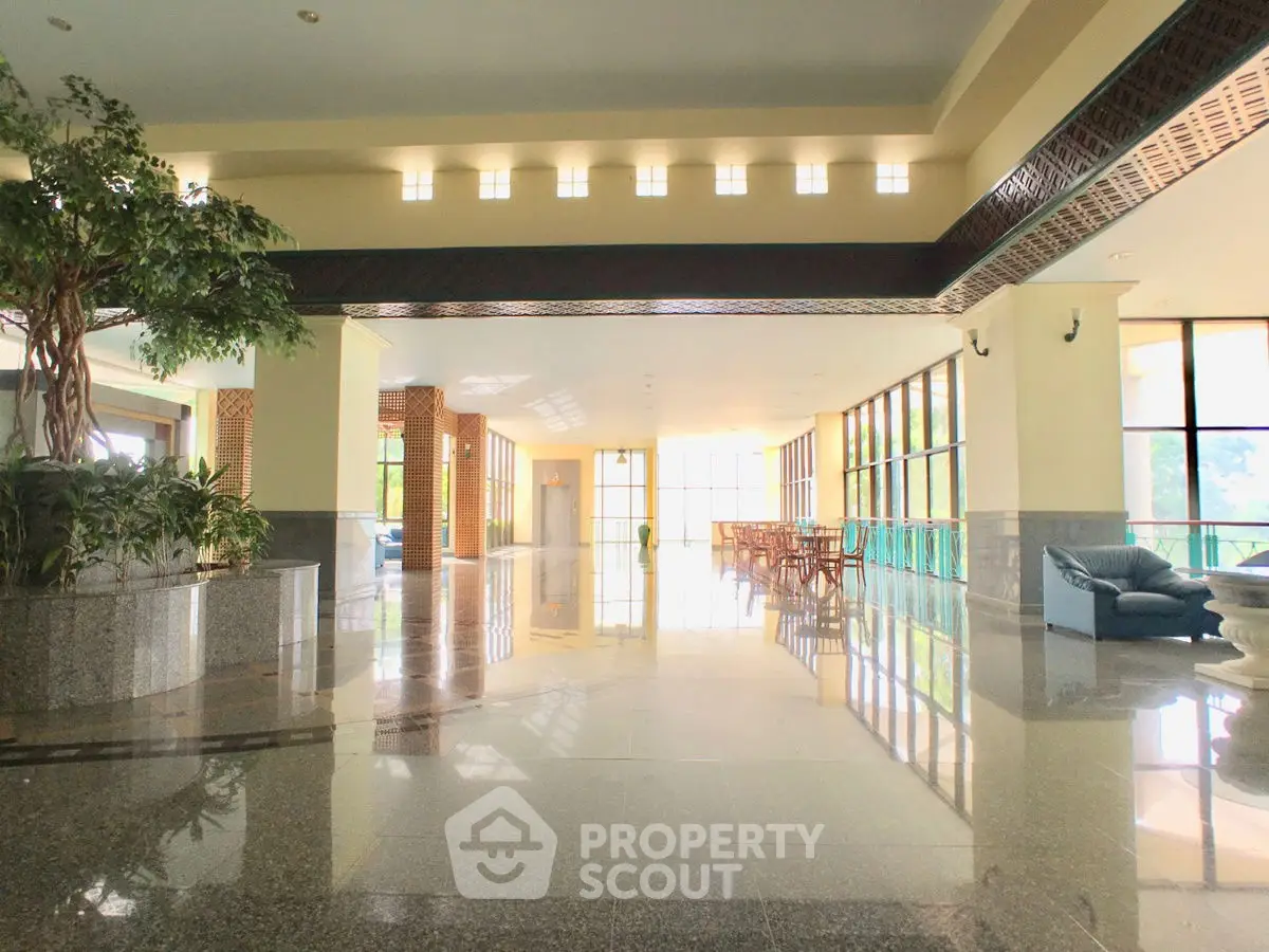 Spacious and elegant building lobby with natural light and modern design.