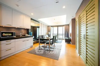Spacious modern living room with open kitchen and elegant dining area