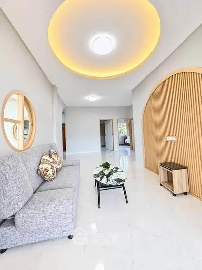 Modern living room with stylish ceiling lights and elegant decor