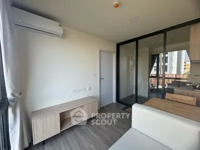 Modern apartment interior with air conditioning and open kitchen layout