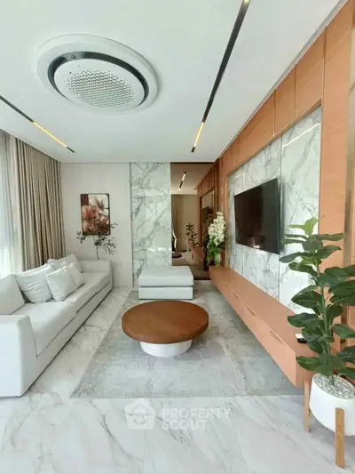 Luxurious modern living room with marble accents and elegant decor
