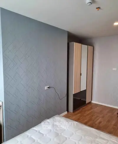 Modern bedroom with stylish wardrobe and elegant wall design