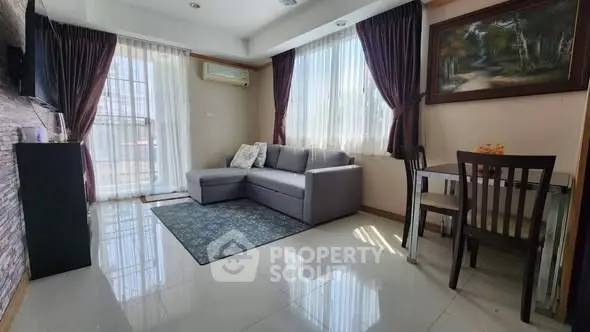 Spacious living room with modern decor and natural light