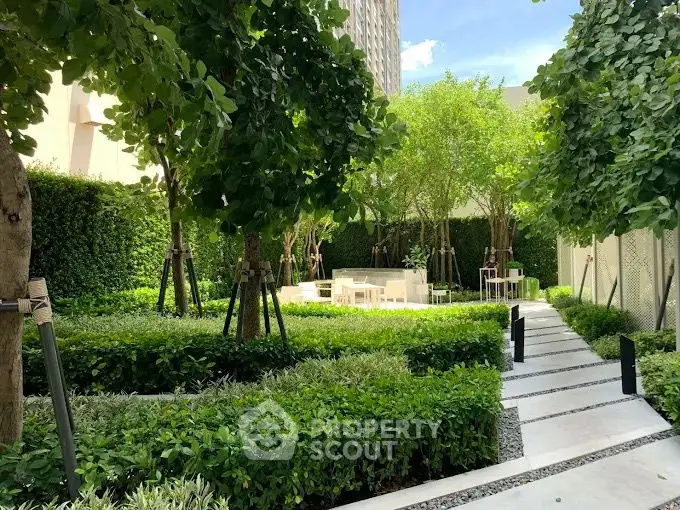 Lush garden with modern seating area in urban residential complex