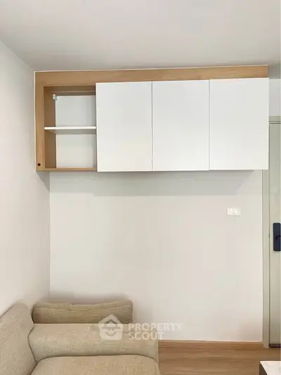 Modern living room with minimalist wall cabinet and cozy sofa