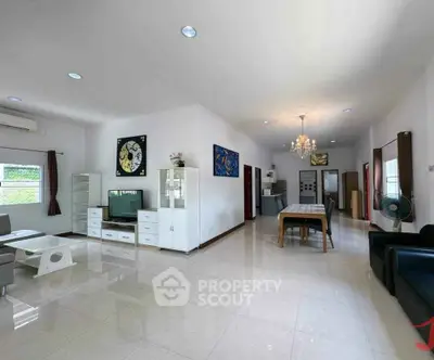 Spacious modern living room with elegant dining area and stylish decor