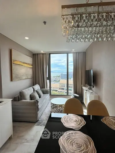 Luxurious living room with elegant chandelier and stunning city view