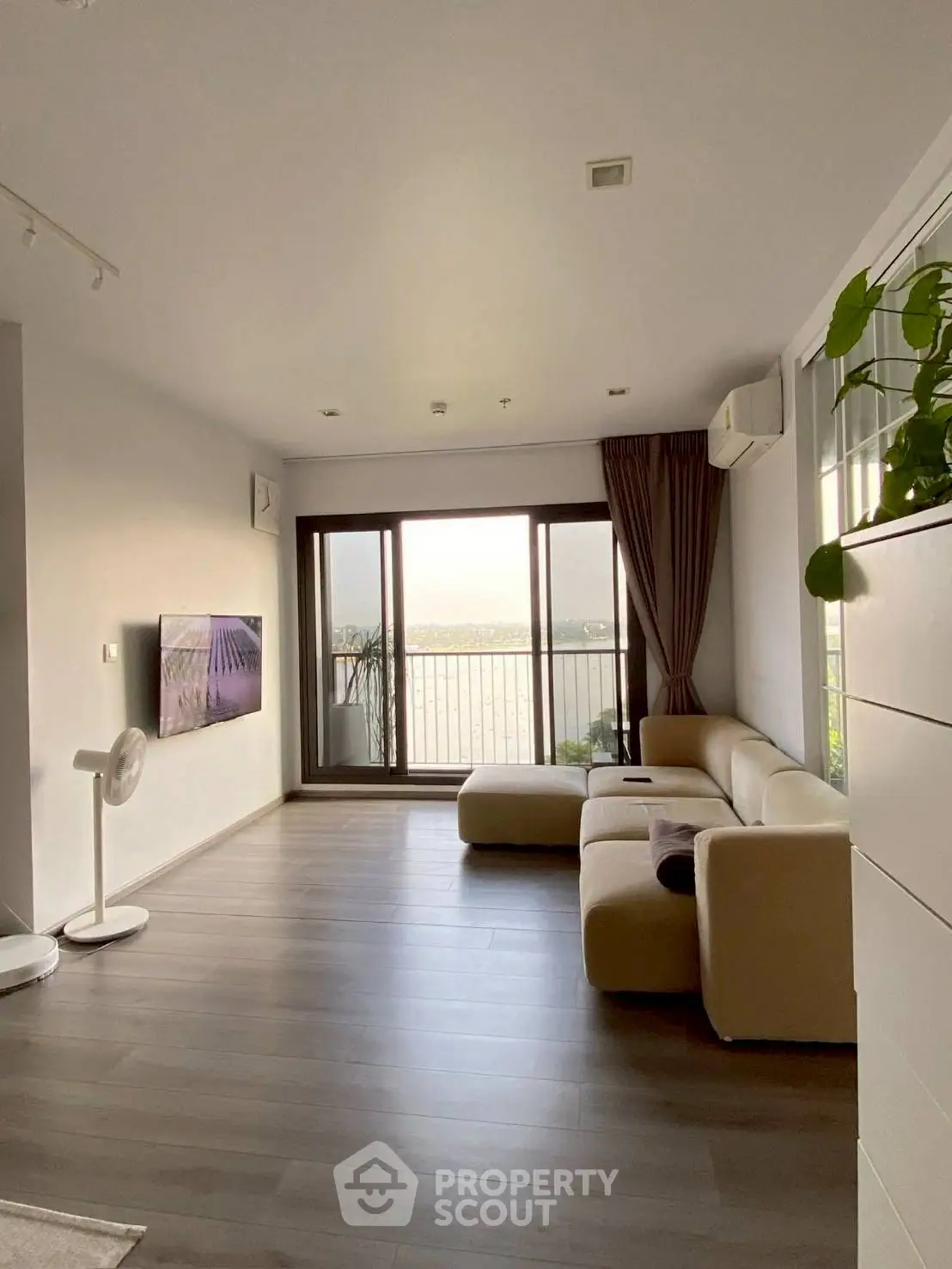 Modern living room with large windows and scenic view