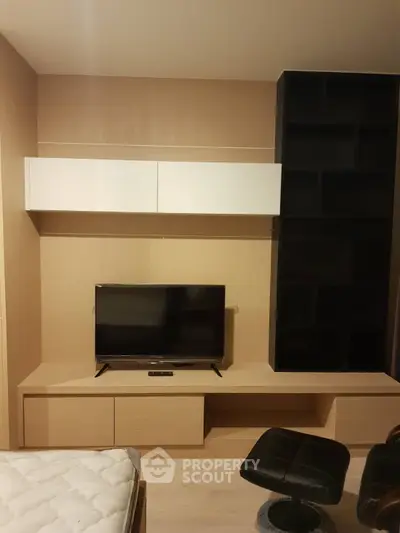 Modern living room with sleek TV unit and stylish shelving