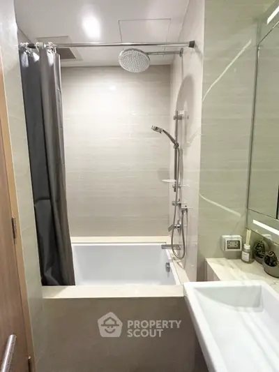 Modern bathroom with sleek shower and bathtub in a contemporary apartment