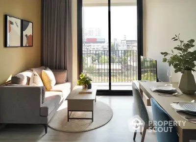 Modern living room with balcony view, stylish furniture, and natural light