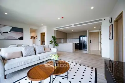 Spacious modern living room with open kitchen and stylish decor