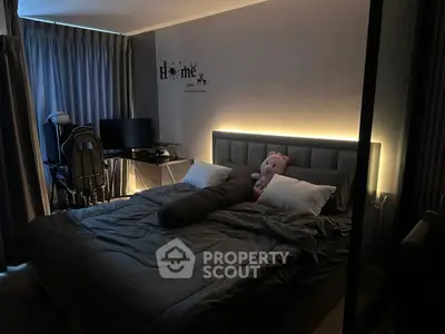 Cozy bedroom with ambient lighting and plush decor for a restful retreat.