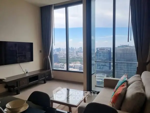 Modern living room with floor-to-ceiling windows and stunning city view
