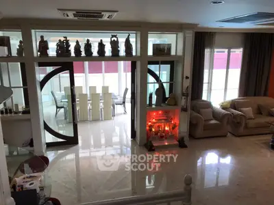 Spacious living room with elegant decor and dining area in modern home