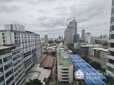 Stunning cityscape view from high-rise building showcasing urban skyline and modern architecture.