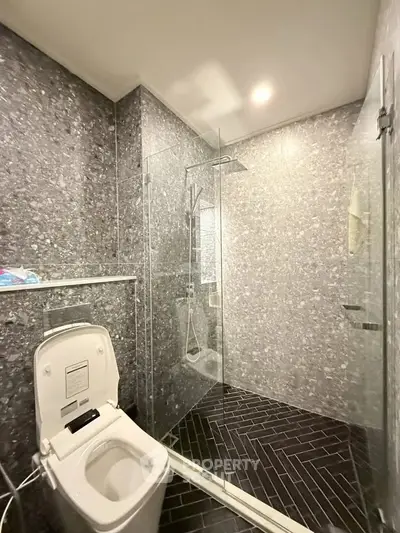 Modern bathroom with sleek glass shower and stylish tile design