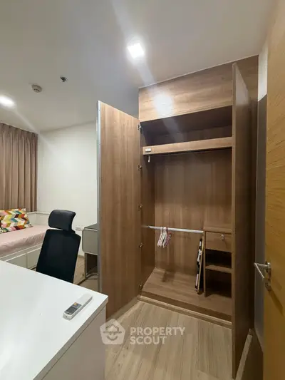 Modern bedroom with open wooden wardrobe and sleek furniture design