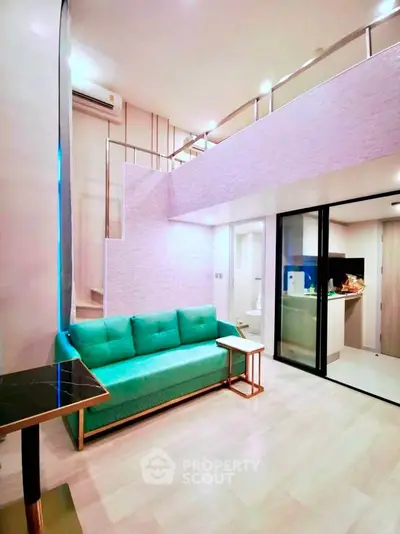 Modern living room with loft design and vibrant green sofa in stylish apartment.