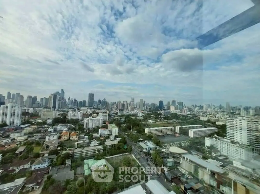 Stunning cityscape view from a high-rise building showcasing urban skyline.