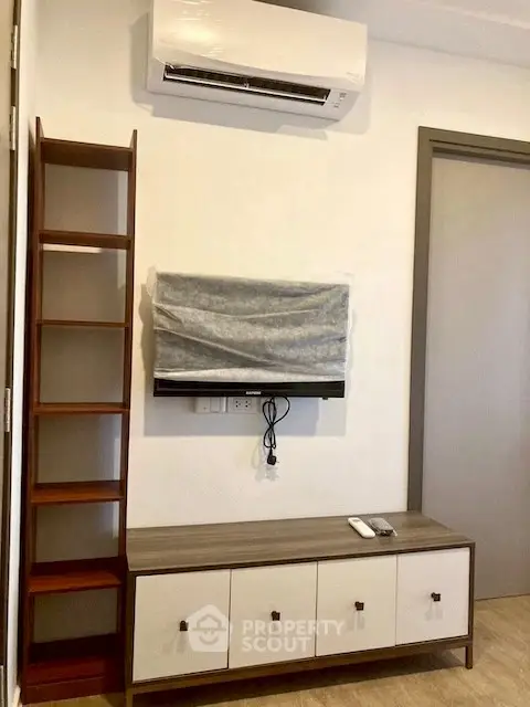 Modern living room with air conditioning and stylish TV setup