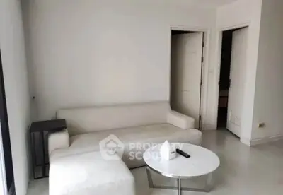 Modern minimalist living room with white sofa and sleek coffee table