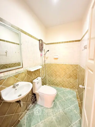 Modern bathroom with stylish tiles and compact fixtures
