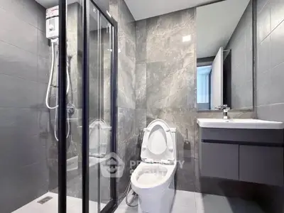 Modern bathroom with sleek design and glass shower enclosure