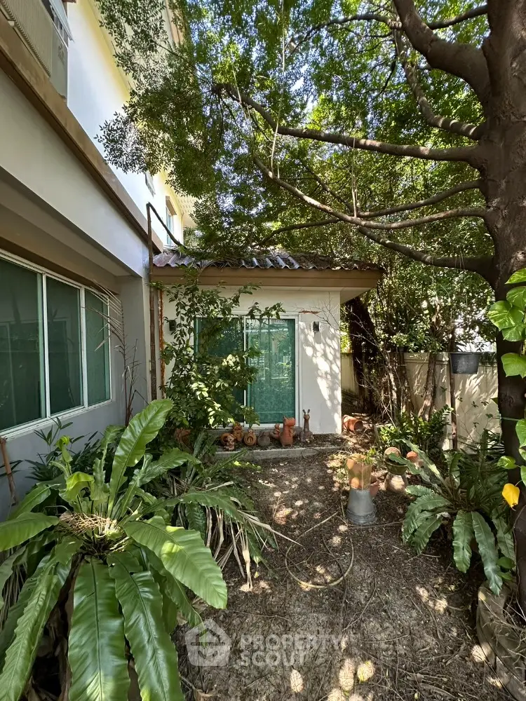 Charming garden view with lush greenery and cozy outdoor space