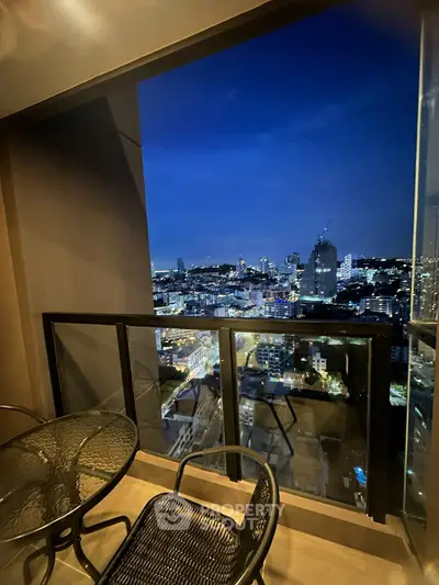 Stunning city view from a modern balcony at night, perfect for urban living.